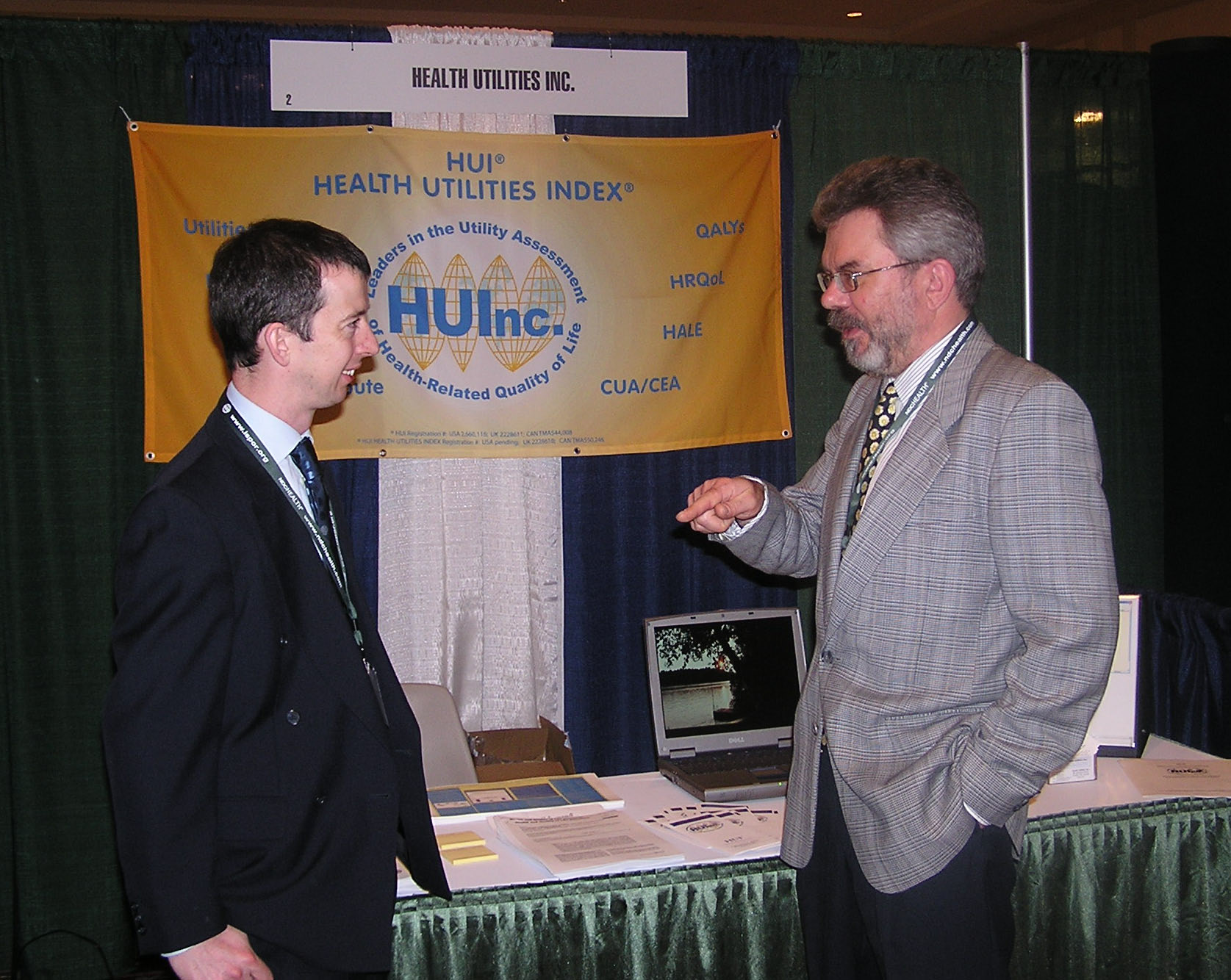 L to R - Chris McCabe and Bill Furlong discussing the UK HUI2 valuation project. International Society for Pharmacoeconomics and Outcomes Research - ISPOR, May 2003, Arlington, VA, USA.