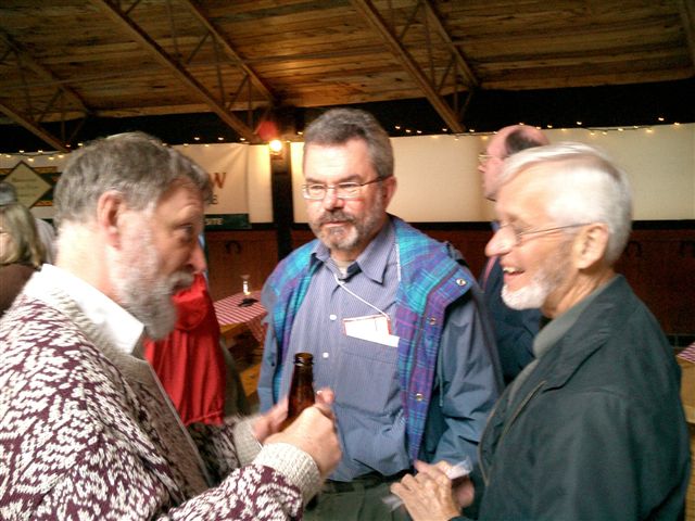 L to R - David Feeny, Bill Furlong, George Torrance comparing notes at the International Society for Technology Assessment in Health Care - ISTAHC, June 2003, Canmore AB, Canada